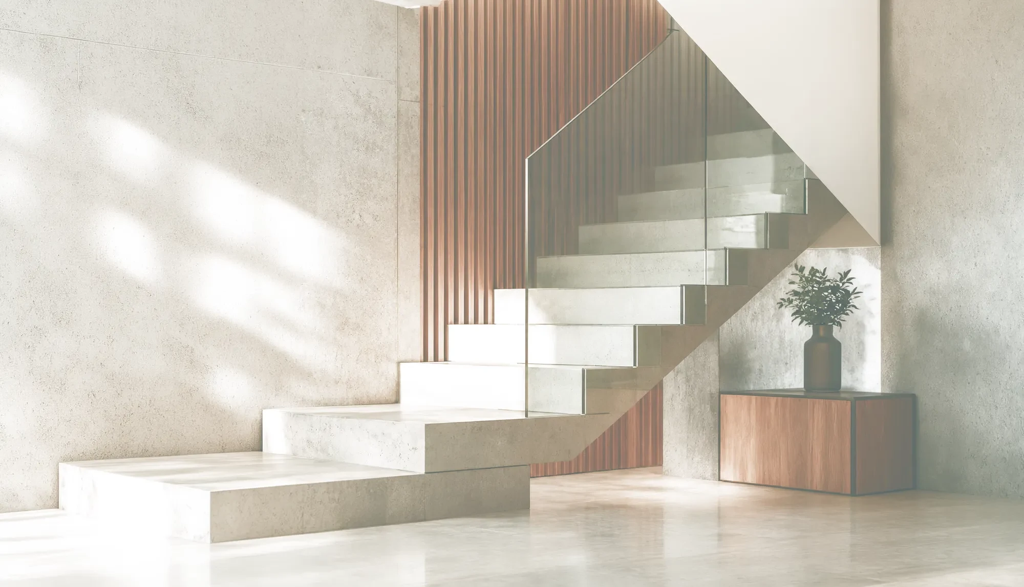 Escada de concreto com luz natural em projeto contemporâneo